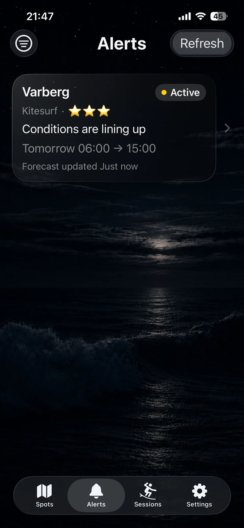 Surflert alerts screen in dark mode showing an active alert and a moonlit ocean background.